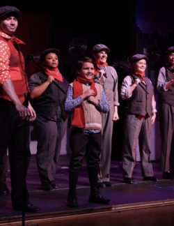 Theatre still photo of a group of people dressed as chimney sweeps.