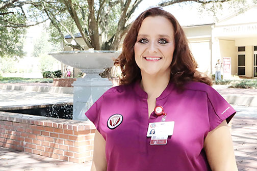 Wallace female nursing student in courtyard