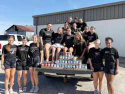 Lady Govs Softball Players with donated canned food