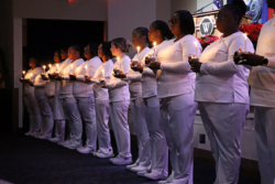 Fall 2025 PN Graduates Holding Candles During Ceremony