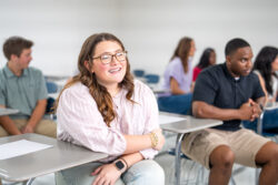 Female WCCD student at desk in classroom