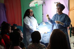 Surgical Technology students with first graders at 2026 SIM Clinic