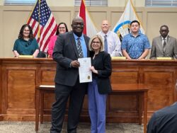 Dean Leslie Reeder with Ozark Mayor and city council for Community College Month