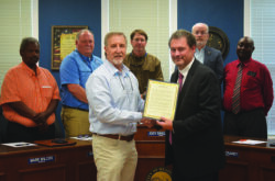 Dean Marc Nicholas with Headland City Council members for Community College Month
